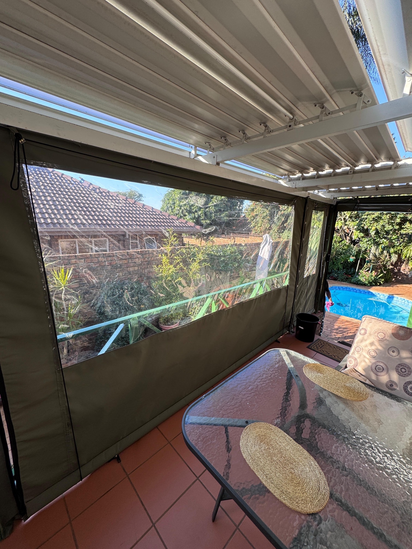 Interior view through clear PVC window of canvas blinds